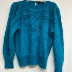 Vintage Venesha Angora Seeater
Turquoise with hand sewn angora flowers on bodice